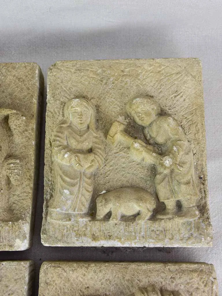 Four antique French carved stone sculptures decorated with country scenes 9½" x 8"