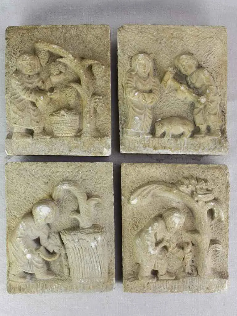 Four antique French carved stone sculptures decorated with country scenes 9½" x 8"